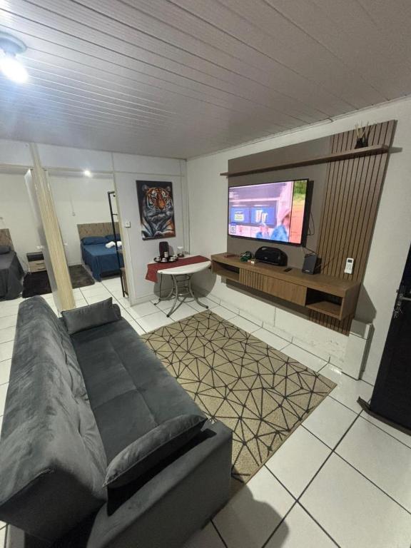 Телевизор и/или развлекательный центр в Casa Família Riese