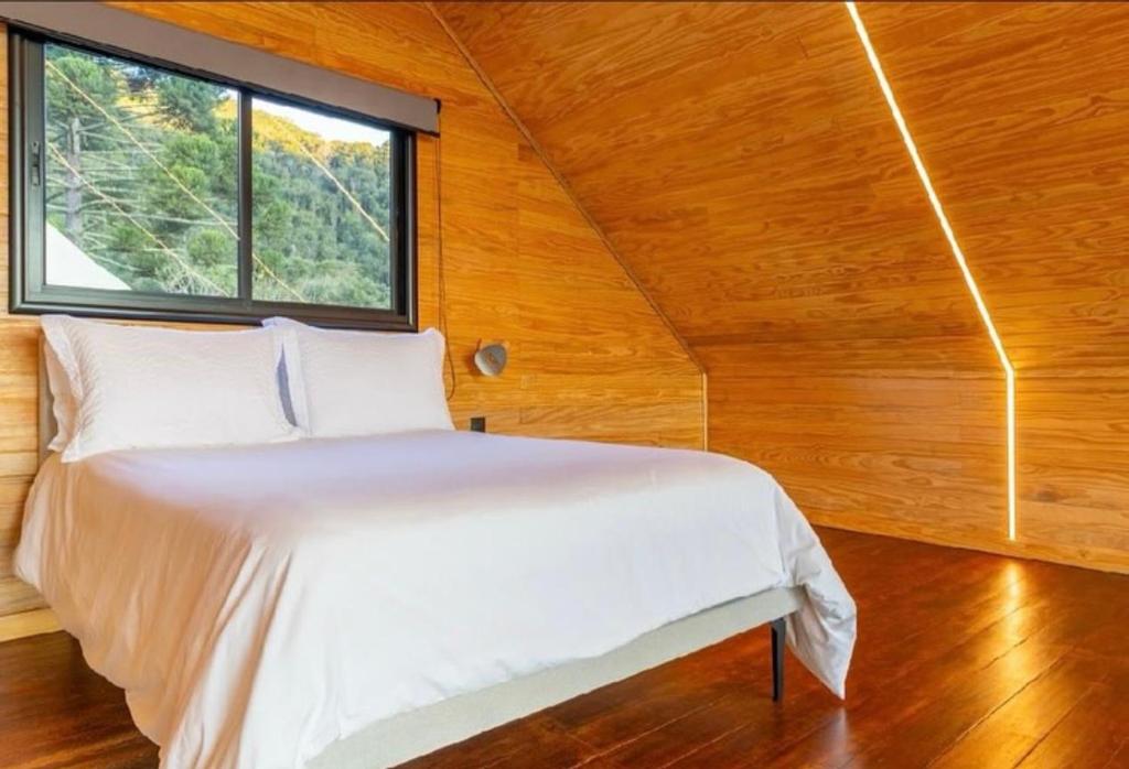 Ένα ή περισσότερα κρεβάτια σε δωμάτιο στο Refúgio da moeda 2