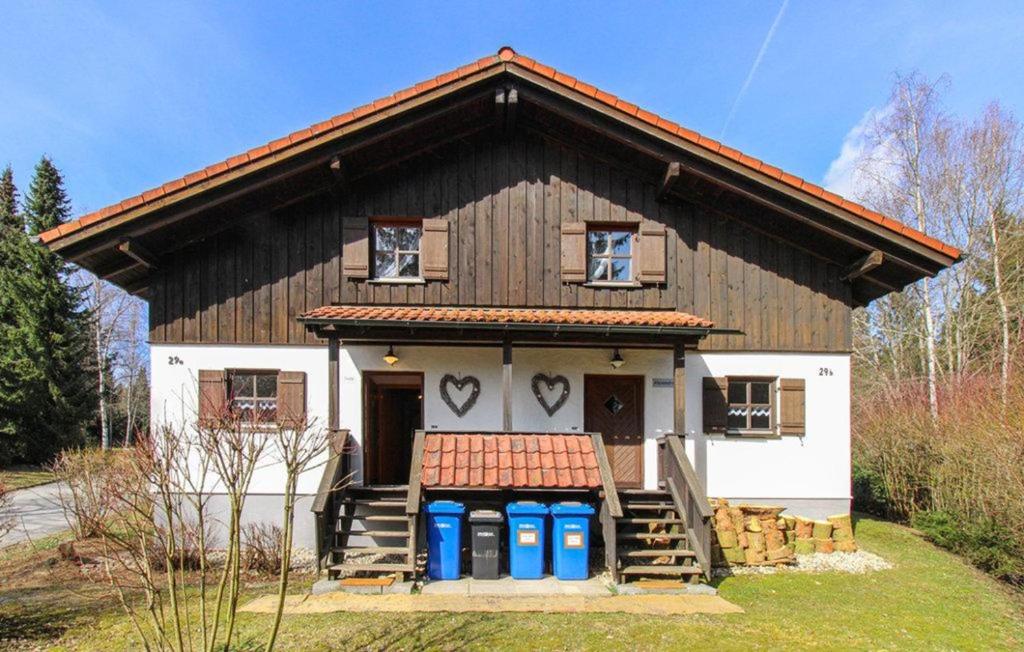 a house with two hearts painted on the front of it at Ferienhaus Alexandra in Regen