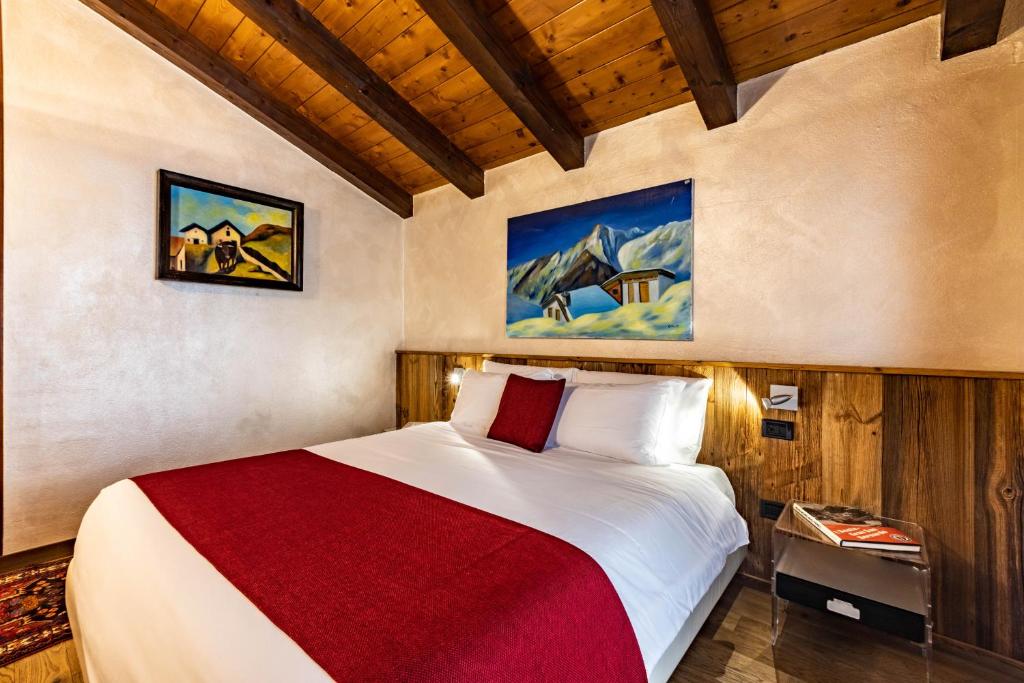 Postel nebo postele na pokoji v ubytování Hotel & Restaurant Le Charaban