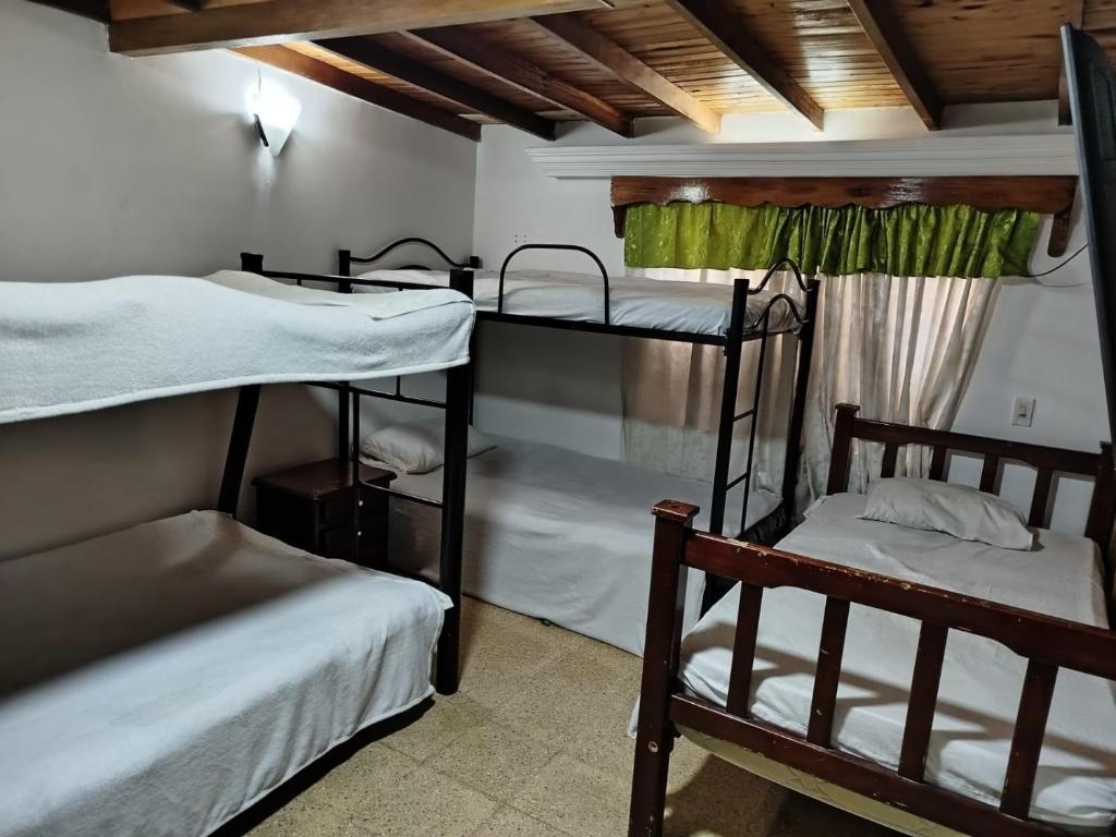 a room with three bunk beds in it at Portal DCE in Envigado