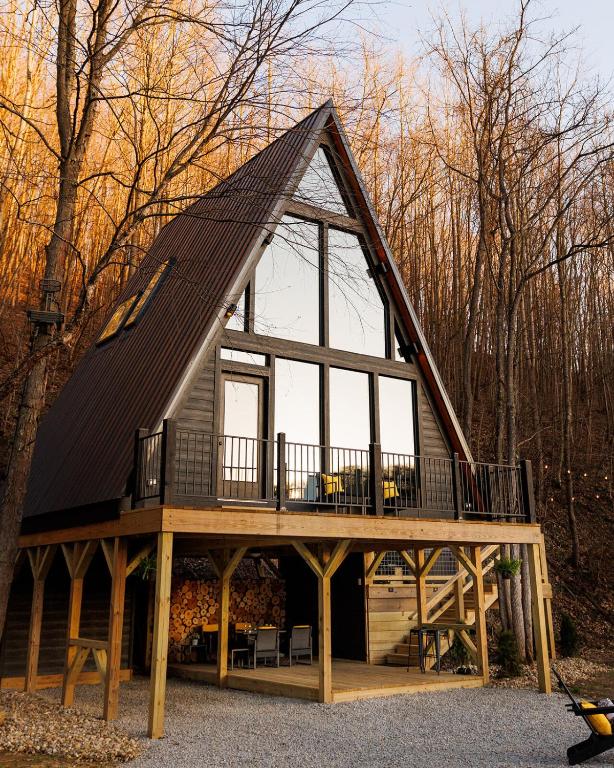 a large wooden house with a gambrel roof at The Pinnacle in Logan