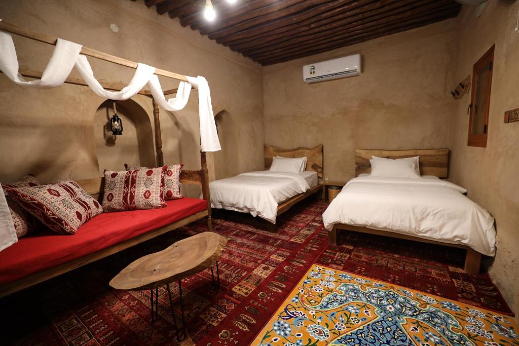 A bed or beds in a room at Beit Al Fateh بيت الفتح