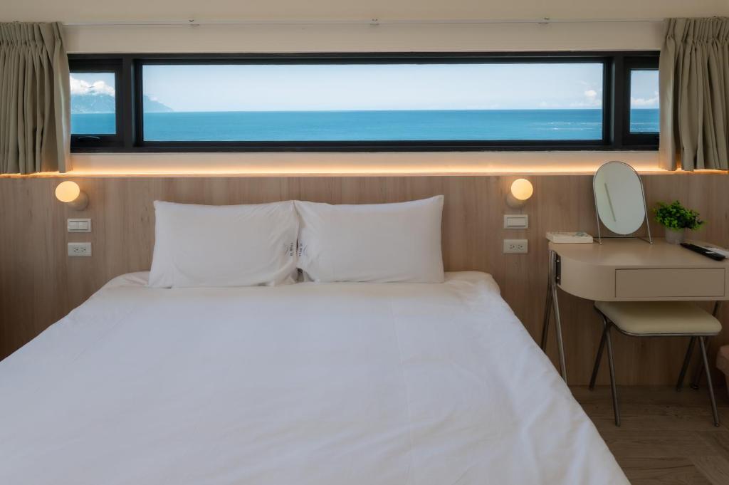 Voodi või voodid majutusasutuse 冉冉七星潭海景民宿 toas