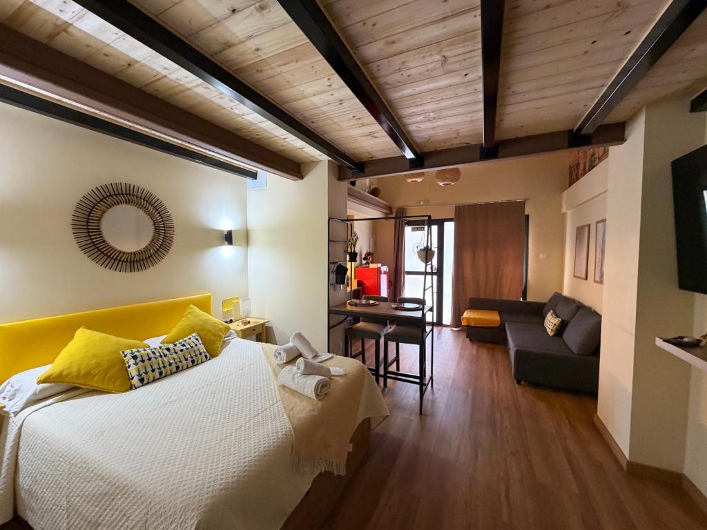 a bedroom with a bed and a living room at Studio 2 Port Valencia in Valencia