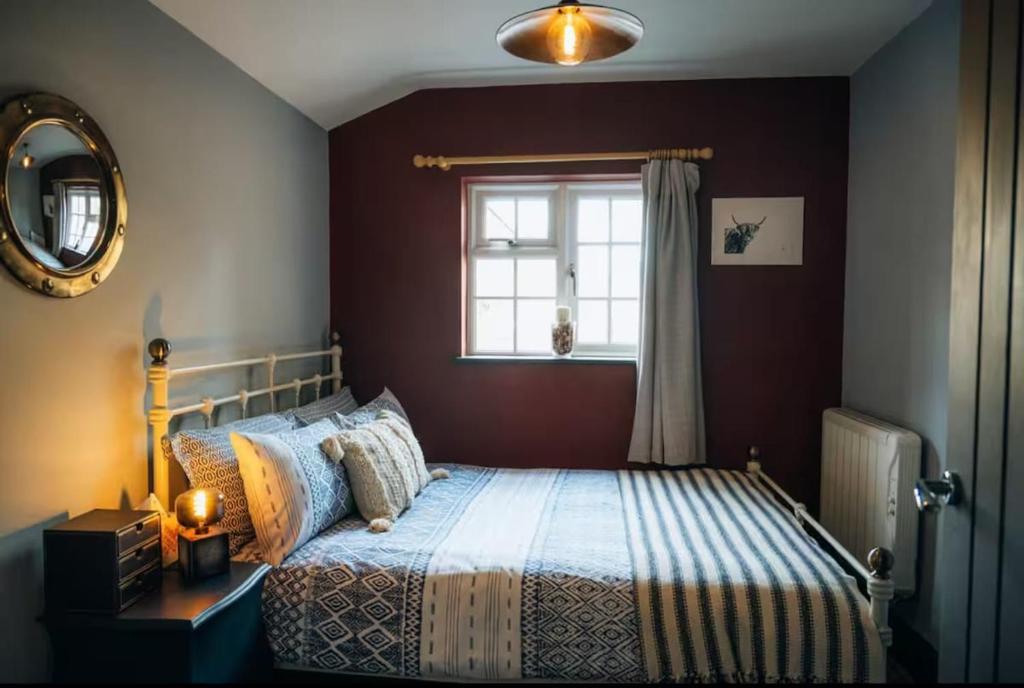 En eller flere senge i et værelse på The Bolt Hole