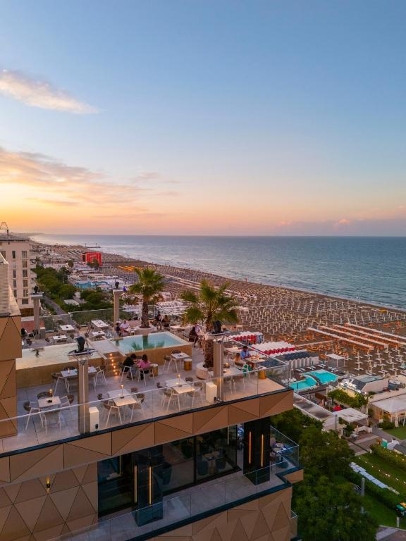 an aerial view of a resort with a beach at The Promenade Luxury Wellness Hotel in Riccione