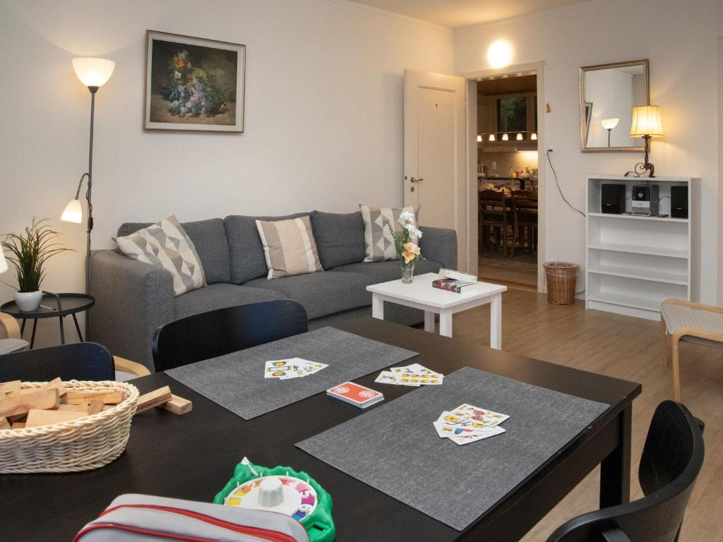 a living room with a couch and a table at Apartment Helene Apt-Diana by Interhome in Wengen