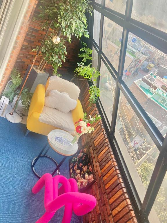 an overhead view of a balcony with a chair and a table at 부산 광안리 B&B stay in Busan
