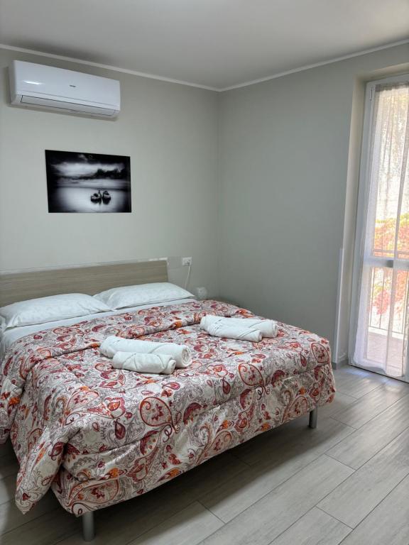 Ένα ή περισσότερα κρεβάτια σε δωμάτιο στο LaPerlaNera