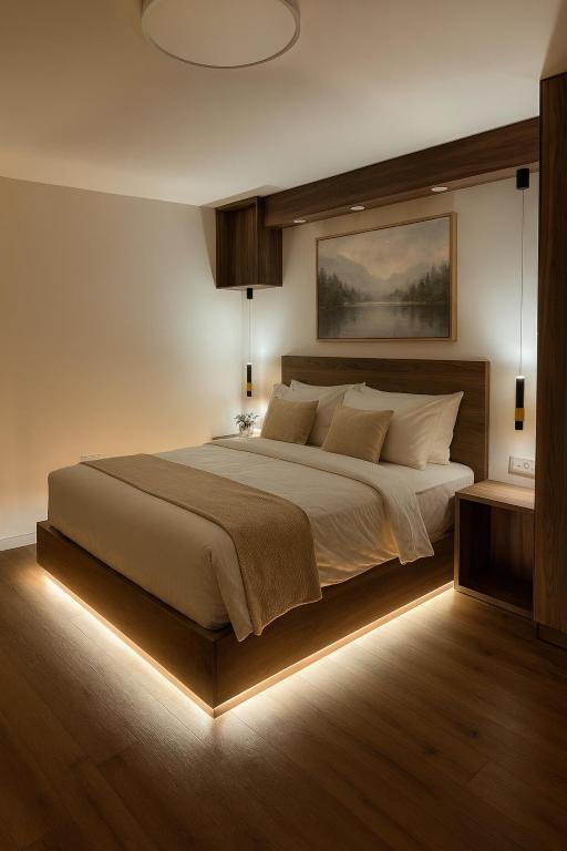 a bedroom with a large bed with a led lighting at The Colony - By Lime Luxe in Haifa