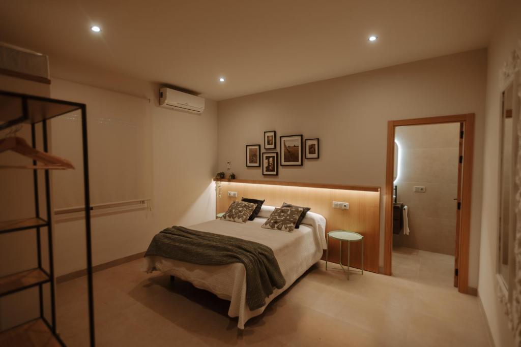 Postel nebo postele na pokoji v ubytování Hotel Asador Las Viñas