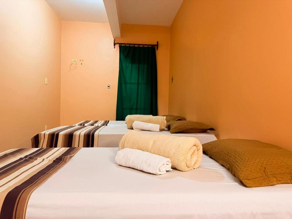 Ένα ή περισσότερα κρεβάτια σε δωμάτιο στο Hotel Coutinho PIO XII