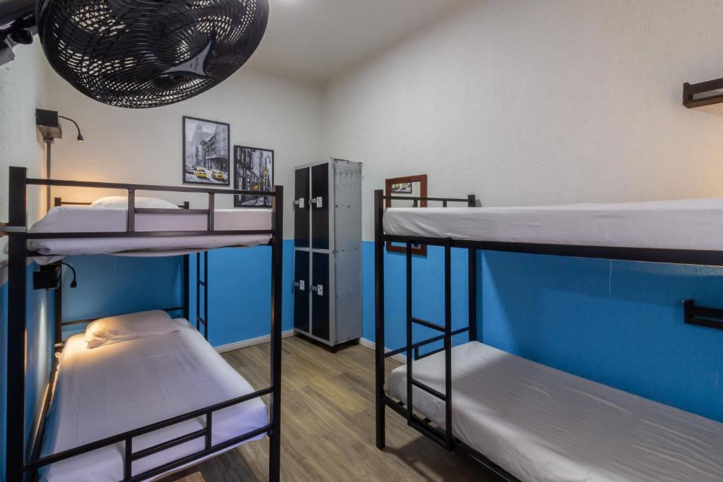 Кровать или кровати в номере Hostel Leblon