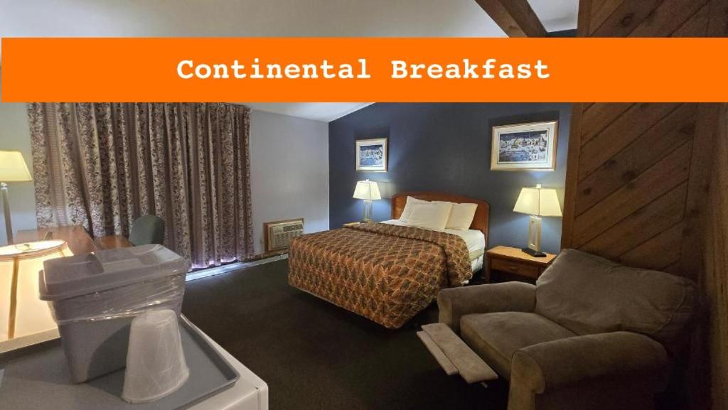 Ένα ή περισσότερα κρεβάτια σε δωμάτιο στο Timber Inn