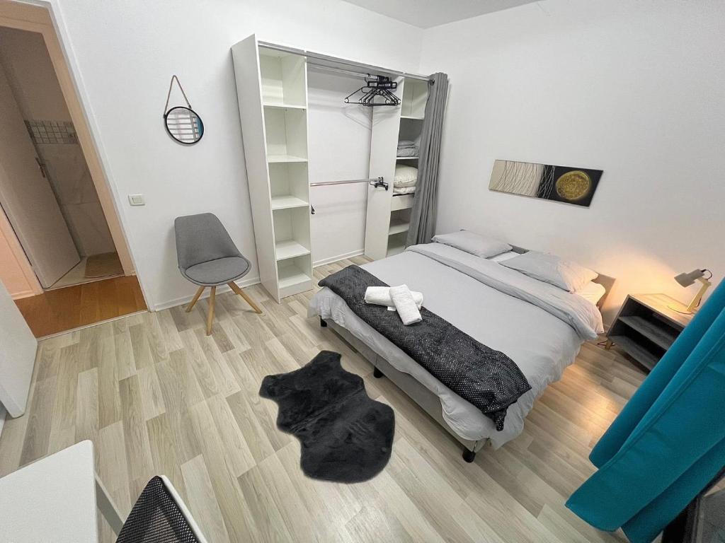 Кровать или кровати в номере Chambre Parisienne - Proche RER & 20 min Paris