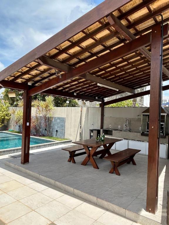 Swimmingpoolen hos eller tæt på Melhores Flats - Linda casa pertinho do mar