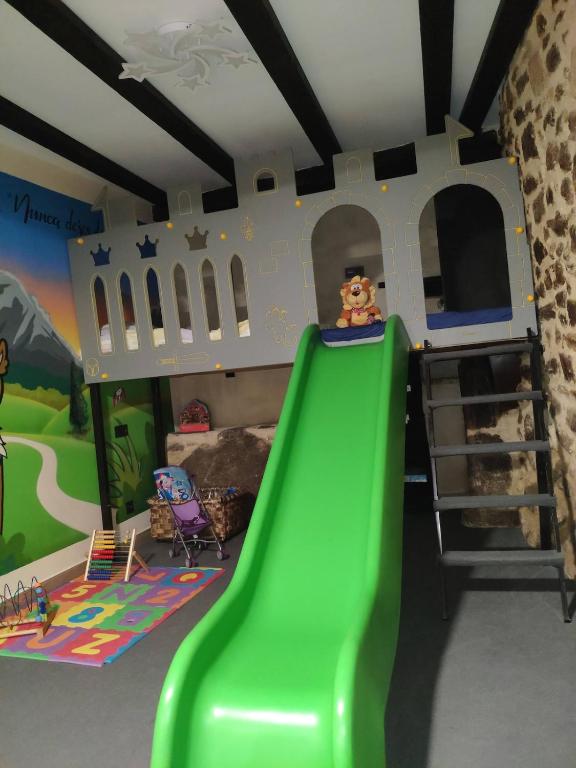 a childs bedroom with a slide and a bunk bed at Bosque animado in La Alberca