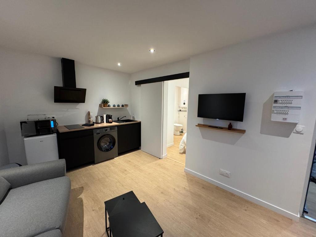 Η κουζίνα ή μικρή κουζίνα στο Appartement moderne et confortable