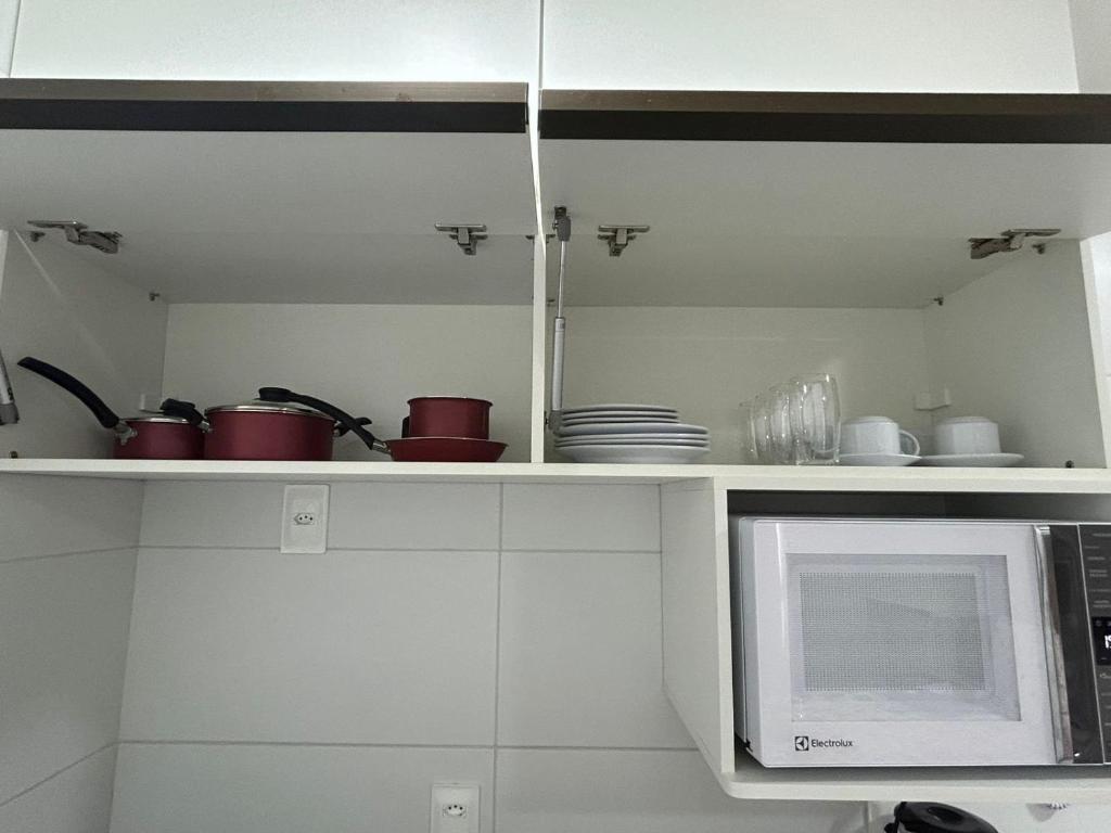 A cozinha ou kitchenette de Melhores Flats - Tranquilo, pertinho do mar