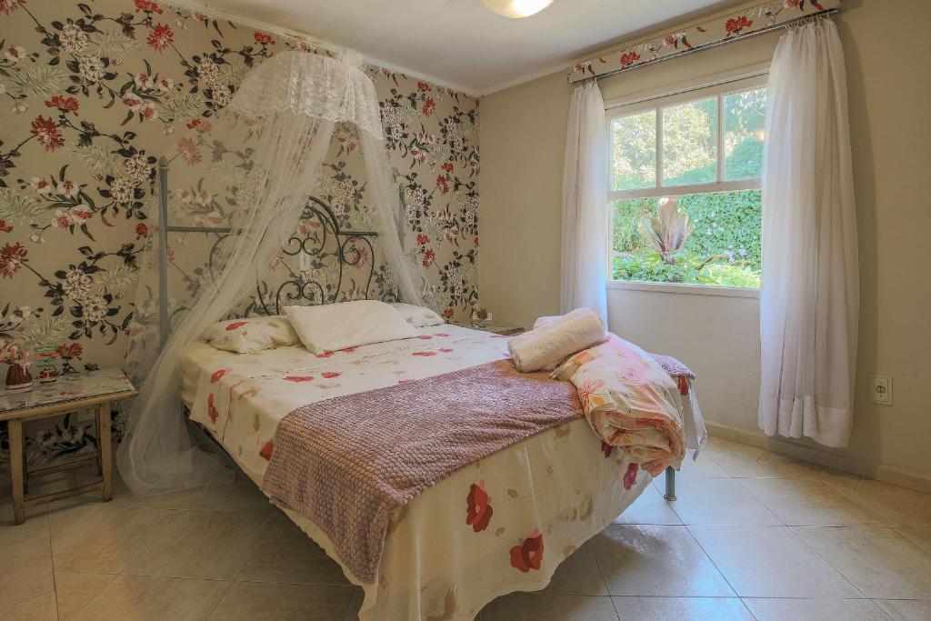 Ένα ή περισσότερα κρεβάτια σε δωμάτιο στο Quinta do Vale - Casa de Boneca: Piscina, lago, caiaque, cascata