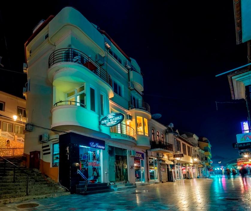 a building on a city street at night at Villa Sveti Gorgi in Ohrid