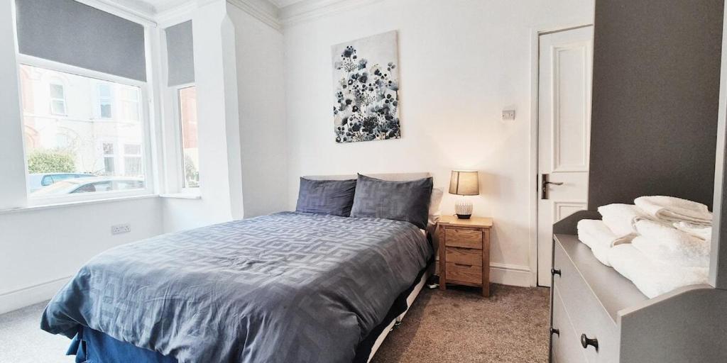 a bedroom with a bed and a window at The Burford Hideaway in Nottingham