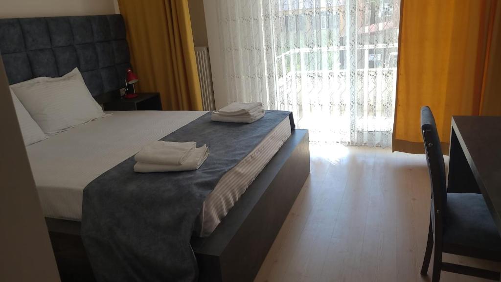 Ένα ή περισσότερα κρεβάτια σε δωμάτιο στο Sirin Residence