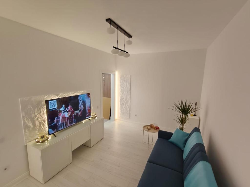 TV a/nebo společenská místnost v ubytování Home Ready