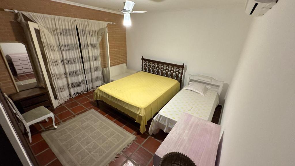 En eller flere senge i et værelse på Pousada Elite Residence - Itanhaém