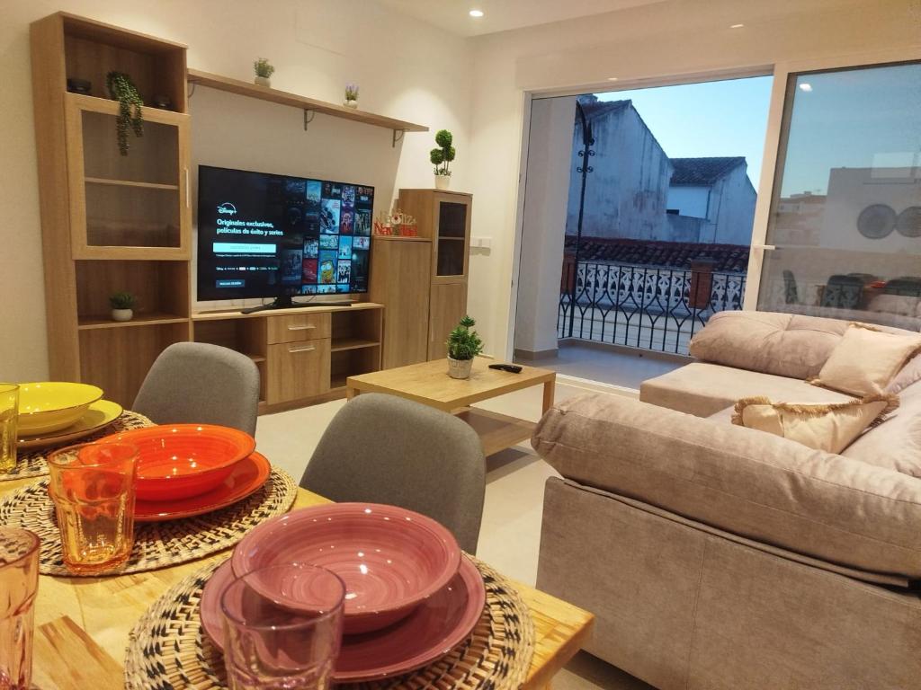 a living room with a couch and a table at Nunes Luxury in Ronda