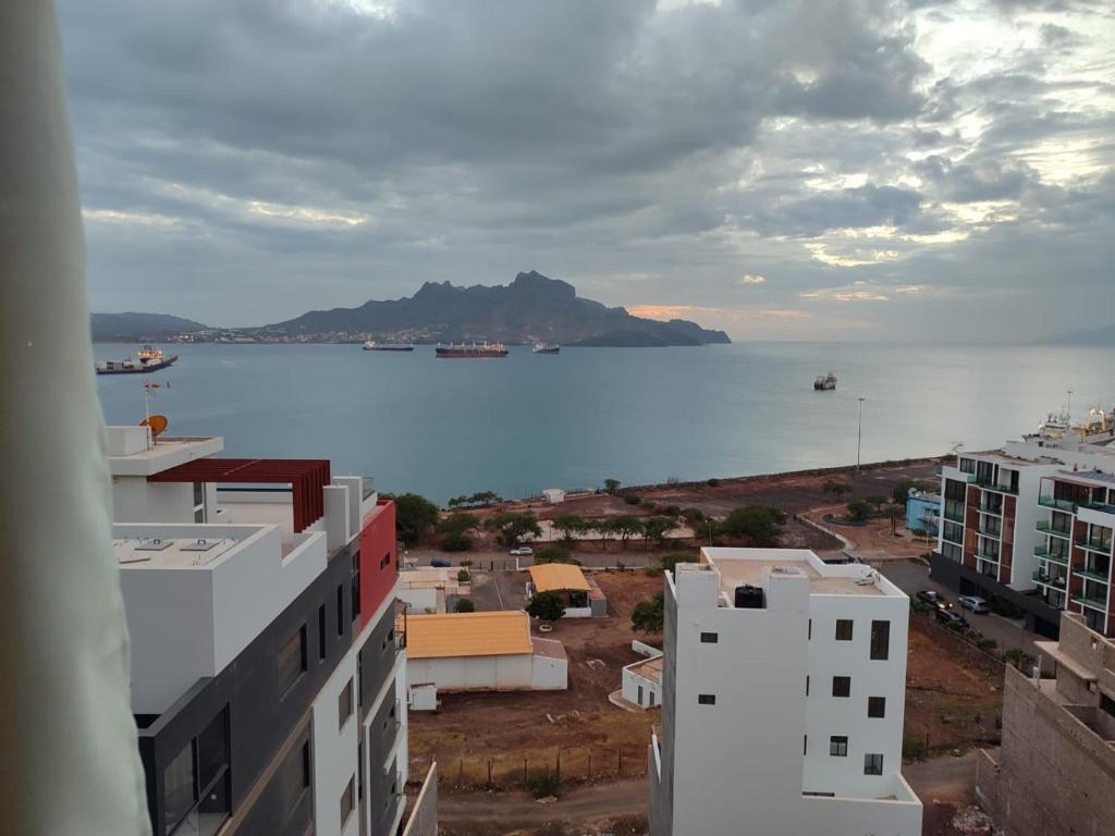 a view of a large body of water with buildings at Residencial P&P in Mindelo