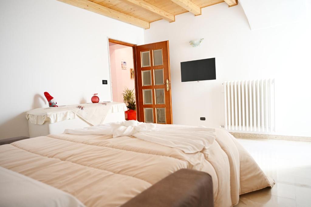 Ένα ή περισσότερα κρεβάτια σε δωμάτιο στο A Casa di Nonna Nunzia - Centro di Gravina - 20min da Matera