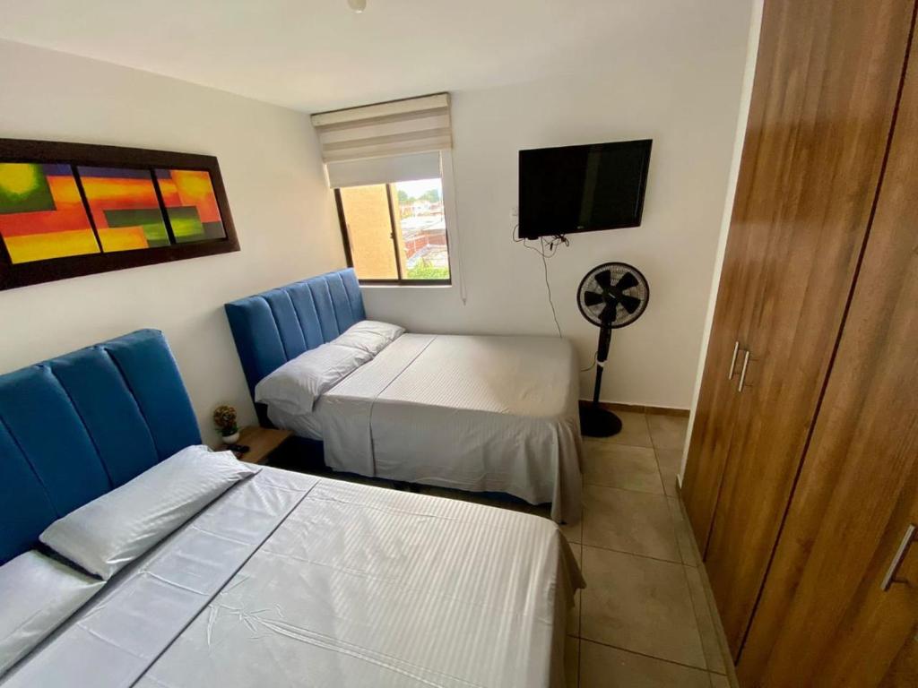 En eller flere senge i et værelse på Alojamiento reserva la colina