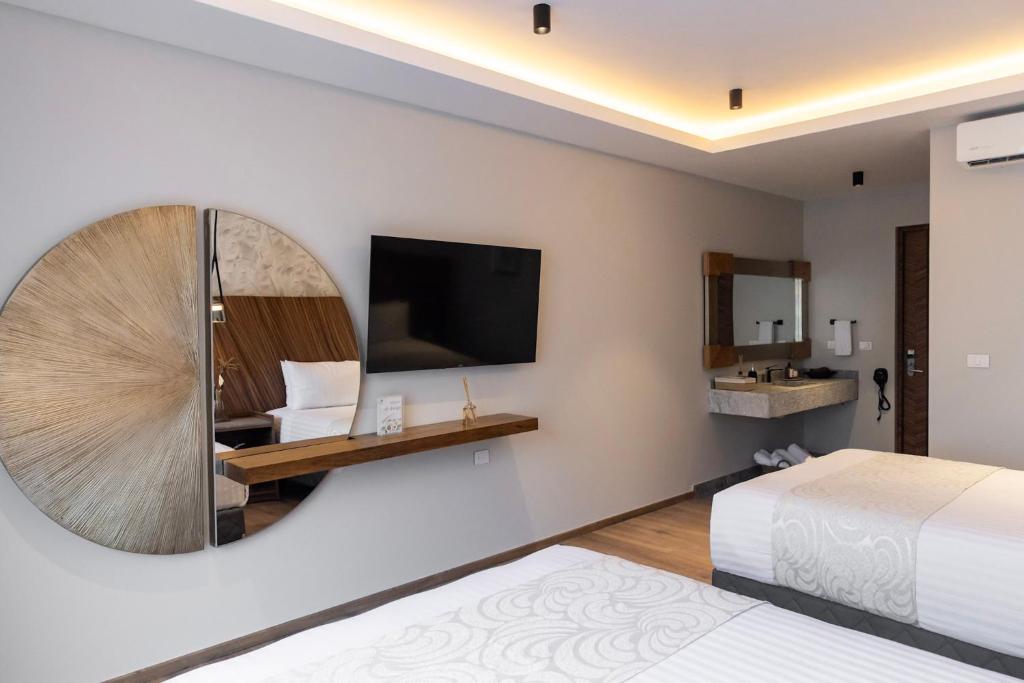 Μια τηλεόραση ή/και κέντρο ψυχαγωγίας στο Hotel Boutique Alma