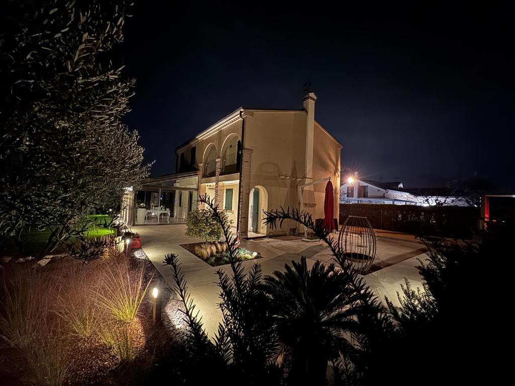 a building at night with lights in front of it at Residenza Galileo -affittacamere Padova sud in Albignasego
