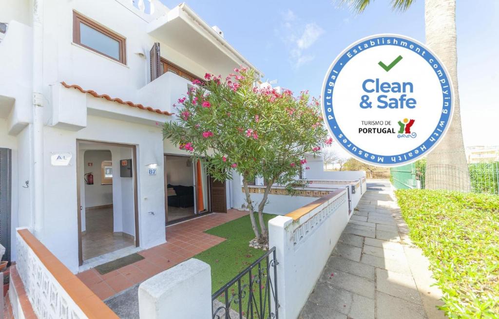 a sign for a clean and safe house at C06 - Water Tower Townhouse in Lagos