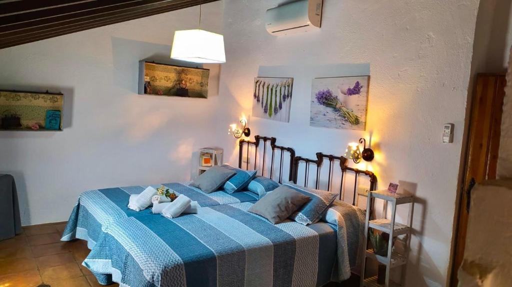 Postel nebo postele na pokoji v ubytování Cortijo Molino los Justos