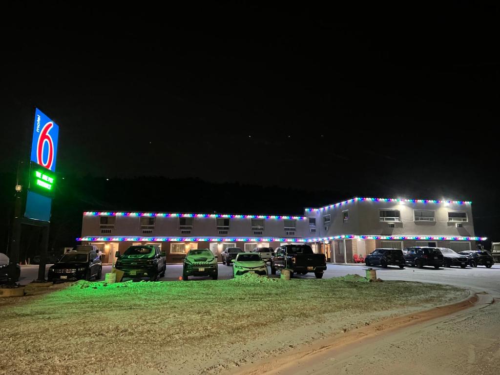 a gas station with cars parked in a parking lot at Motel 6-Sudbury, ON in Sudbury
