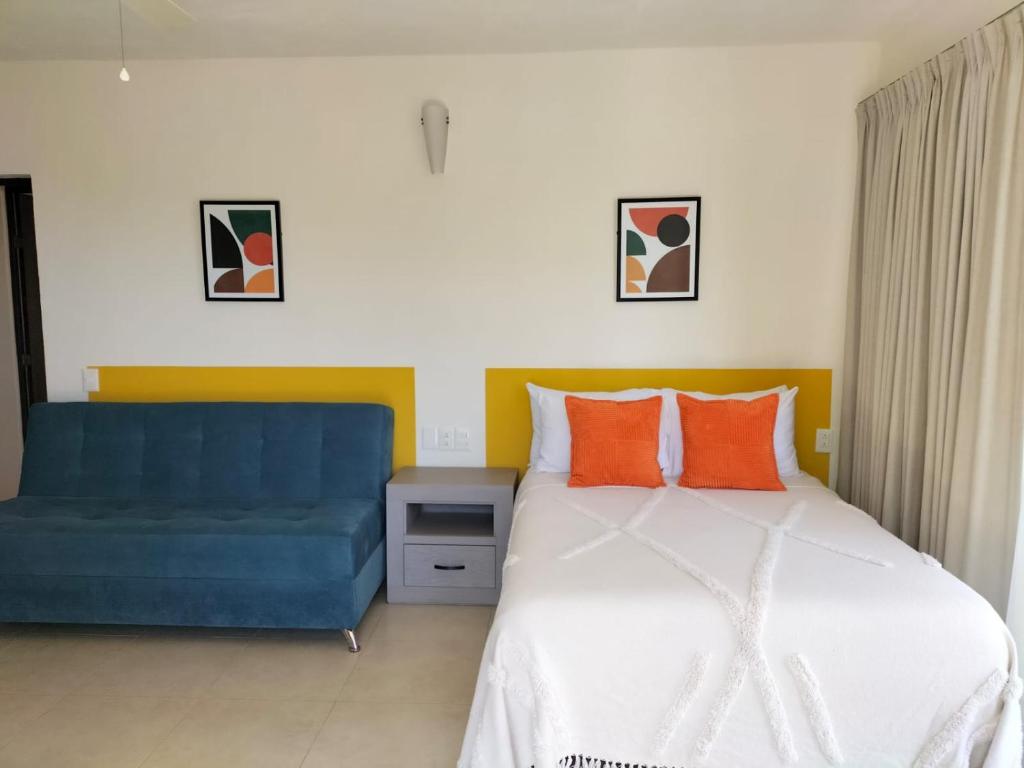 Ένα ή περισσότερα κρεβάτια σε δωμάτιο στο Hotel Majo Sayulita