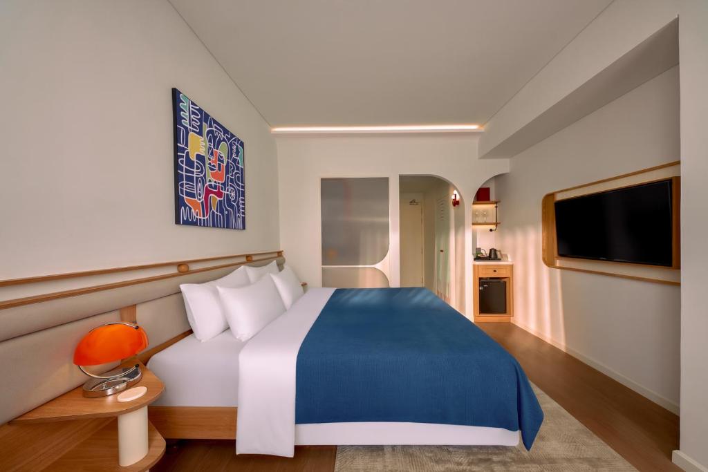 Ένα ή περισσότερα κρεβάτια σε δωμάτιο στο Savvy by M Village Hai Ba Trung - Saigon Downtown