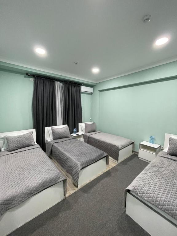 Postel nebo postele na pokoji v ubytování Lider Hotel Tashkent