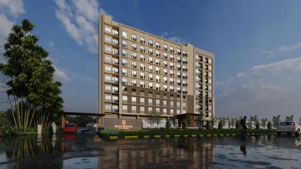 a large building with water in front of it at Bogorienze City Resort in Pamoyanan