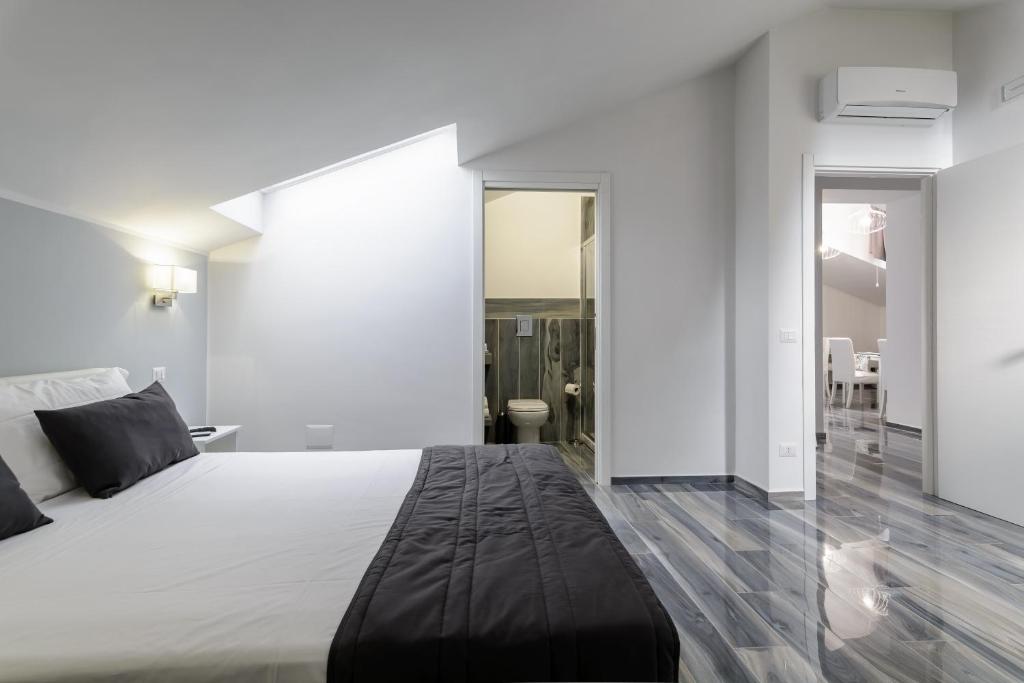Posteľ alebo postele v izbe v ubytovaní B&B al Palazzo