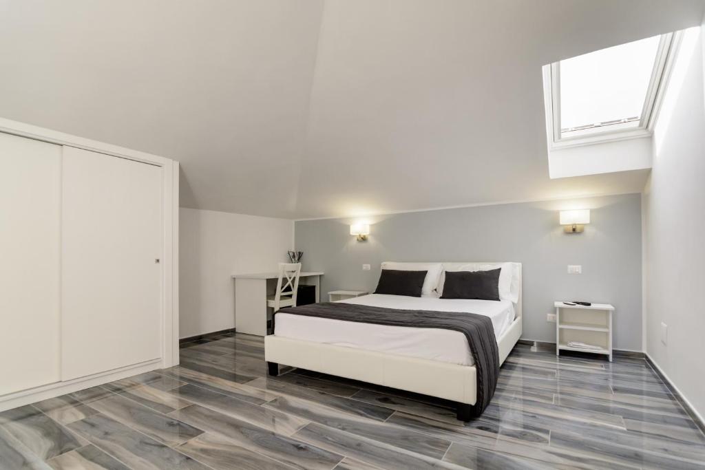 Posteľ alebo postele v izbe v ubytovaní B&B al Palazzo
