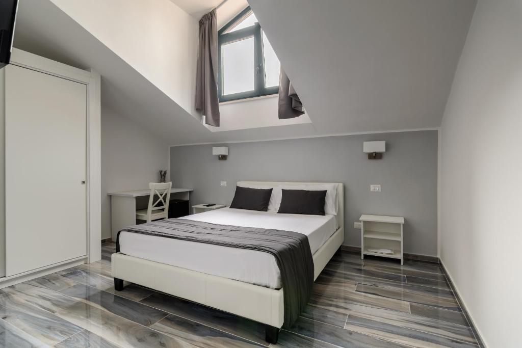 Posteľ alebo postele v izbe v ubytovaní B&B al Palazzo