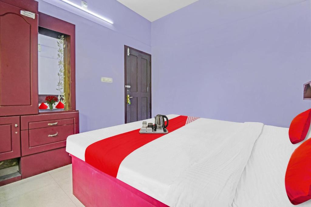 Ένα ή περισσότερα κρεβάτια σε δωμάτιο στο Collection O Clement Holydays