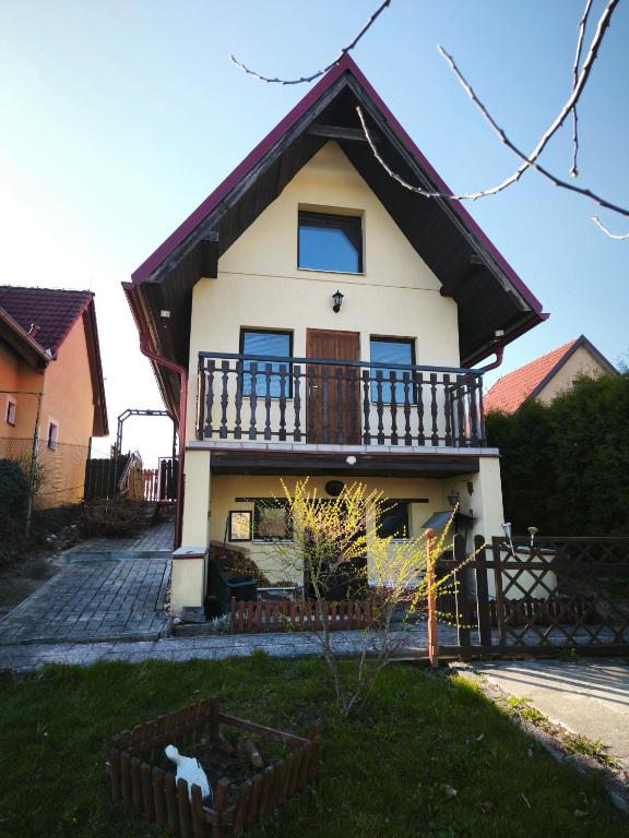 a house with a balcony on the side of it at Chata Vrcov in Vrcov