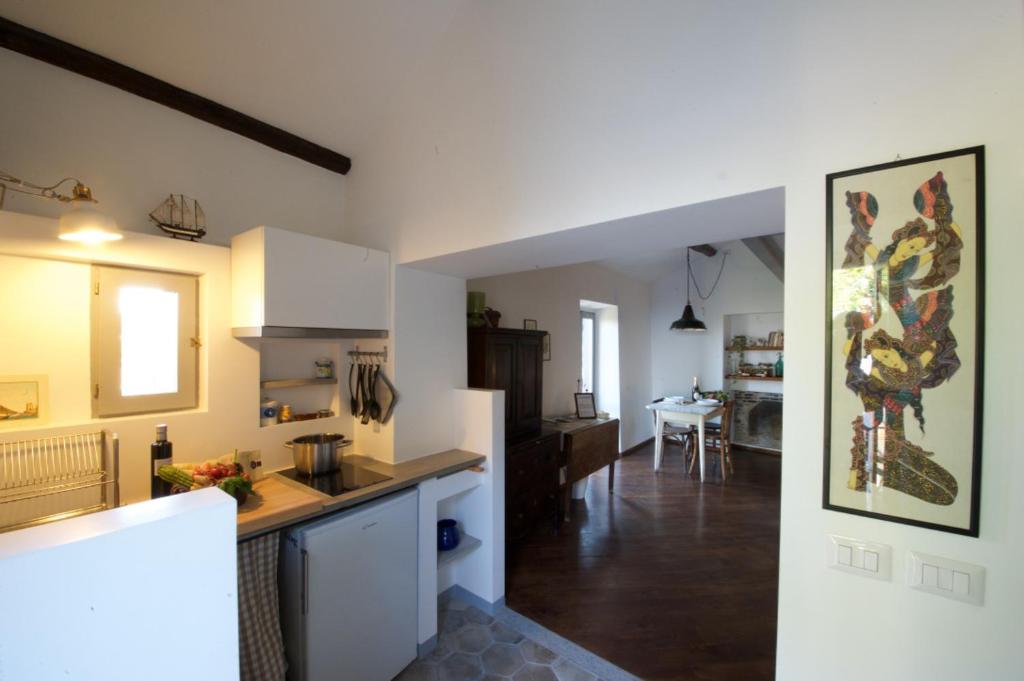 a kitchen and living room with a counter top at La Casetta Belvedere in Bracciano