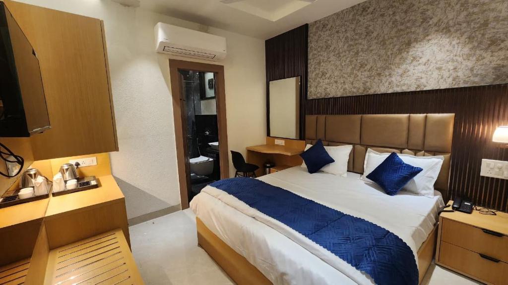 En eller flere senge i et værelse på Somnath Palace